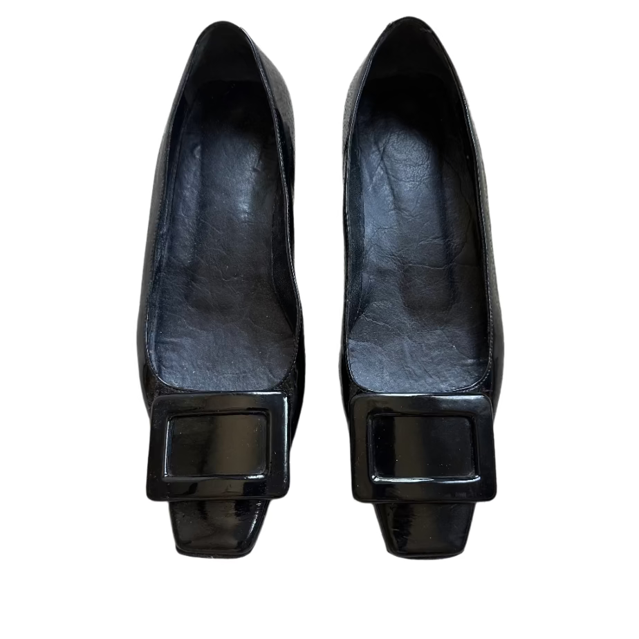 Pair of black shoes with square buckles