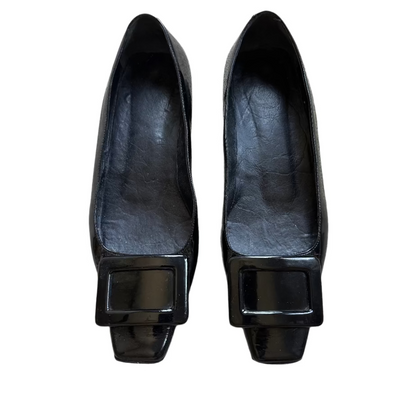 Pair of black shoes with square buckles