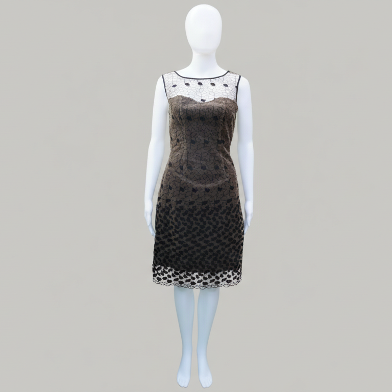 Mannequin wearing a black dress with white lace details on a gray background