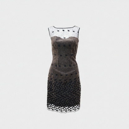 Black dress with white polka dot pattern on a light gray background