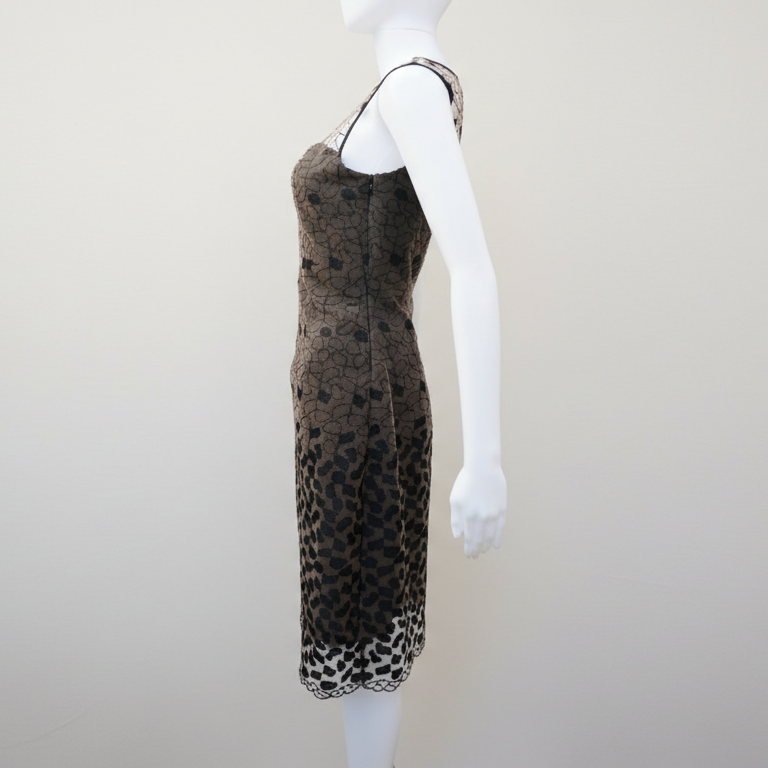 Mannequin wearing a leopard print dress on a plain background